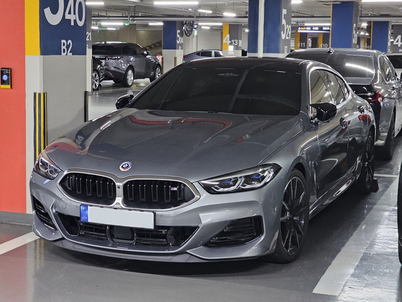 Sleek front profile with kidney grille and sharp headlights