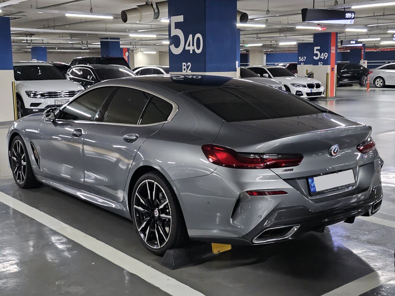 Rear side view of a luxury sport sedan with LED taillights and alloy wheels