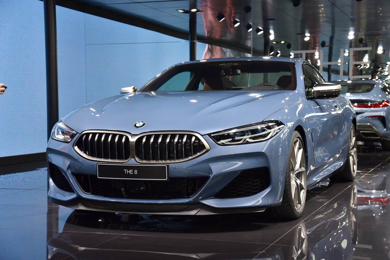 Front view with sharp headlights and kidney grille
