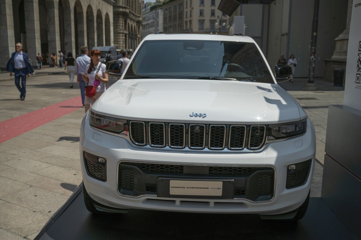 Front view with seven-slot grille, headlights and bumper of SUV