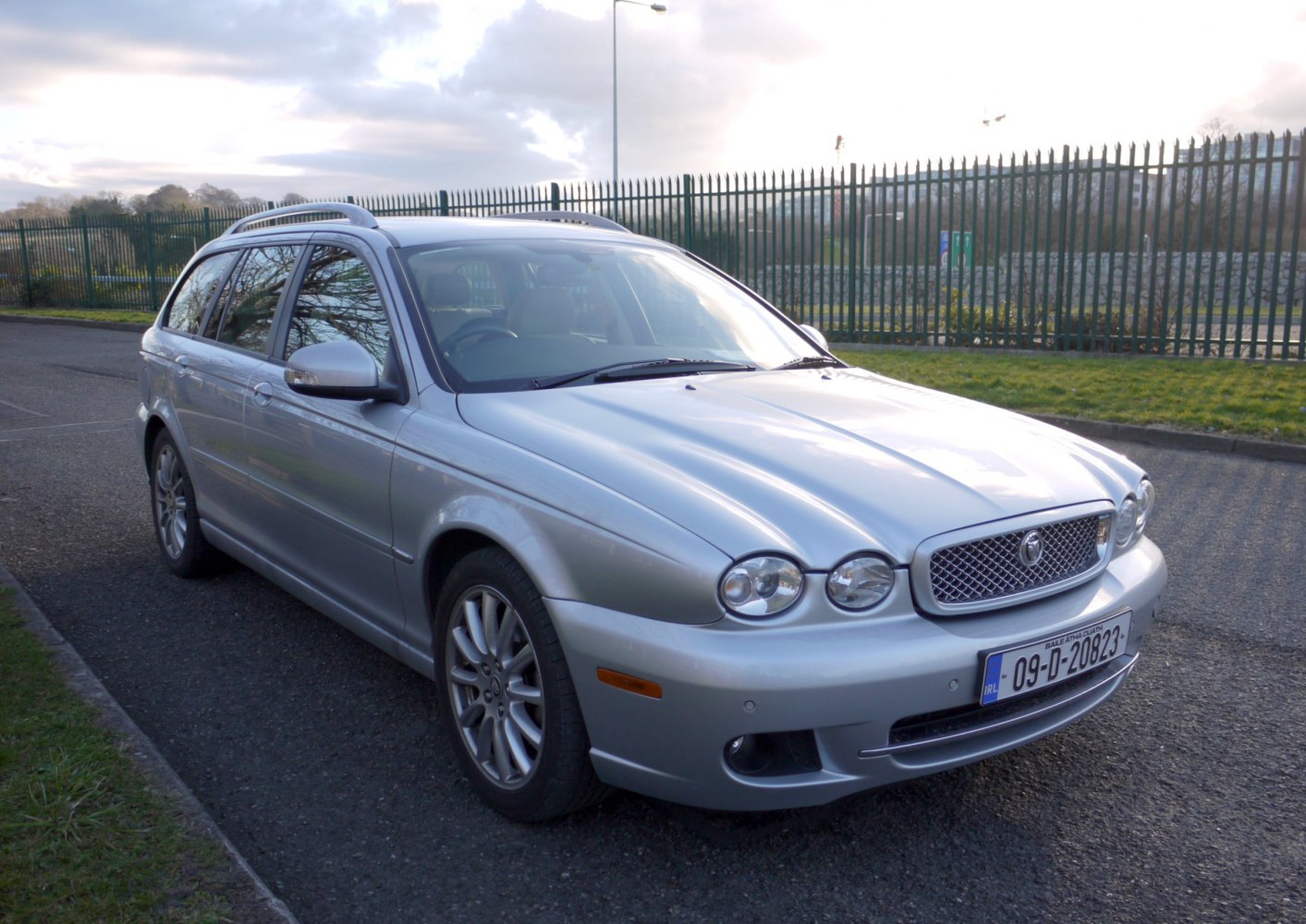 Silver estate with round headlights and mesh grille