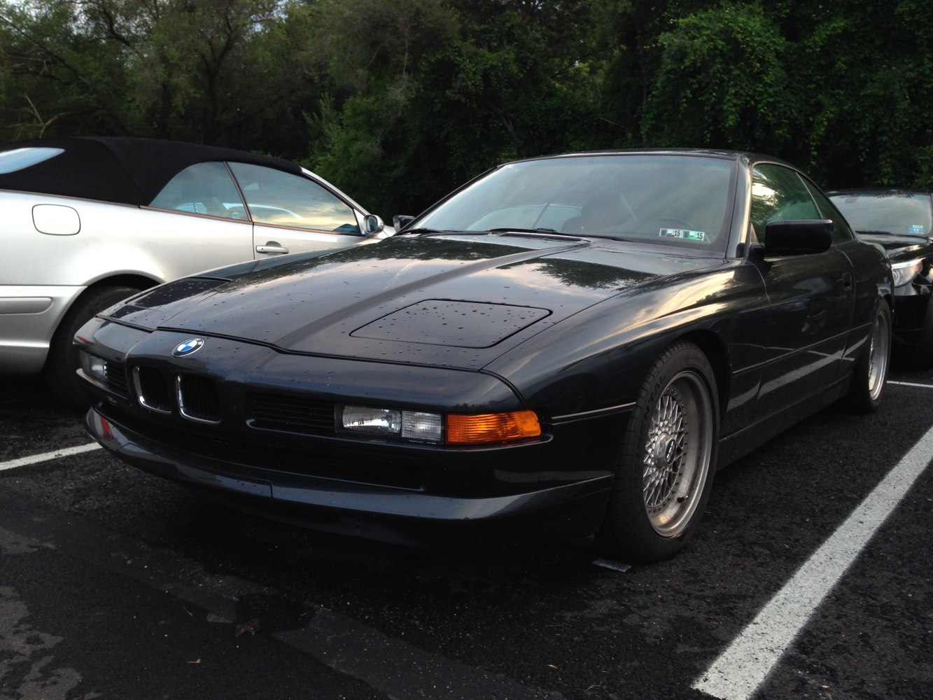 Vintage coupe front with pop-up headlights and distinctive BMW grille