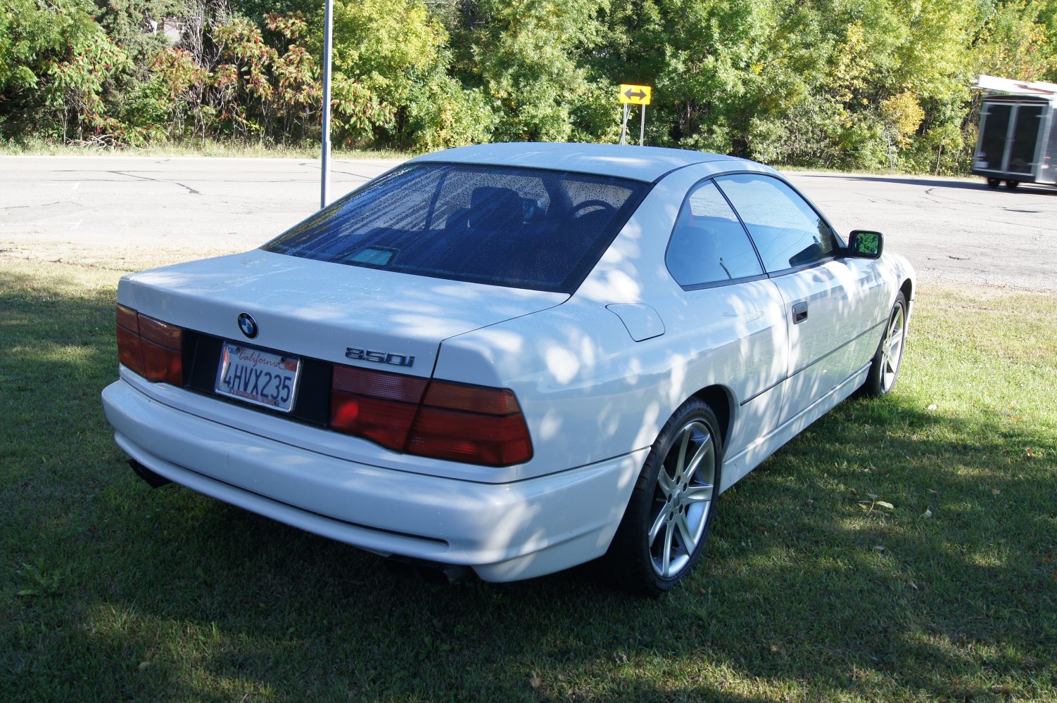 Rear view of white coupe showing distinct taillights and design lines