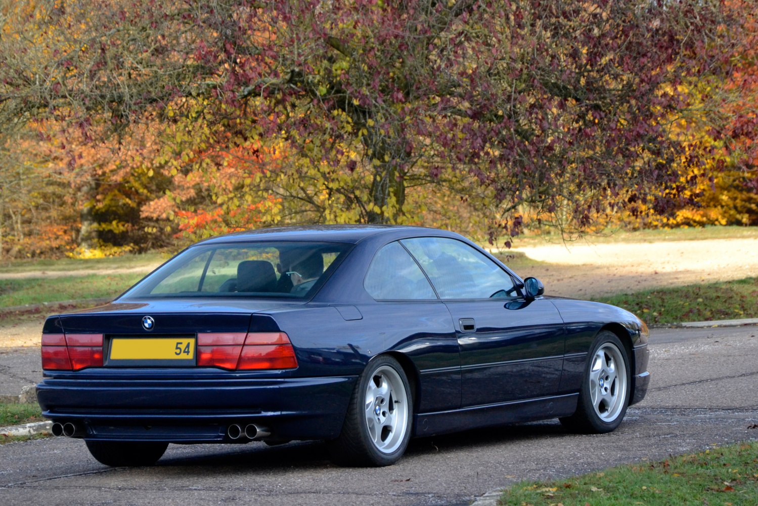 Rear view of BMW 8 Series with dual exhaust and distinctive tail lights