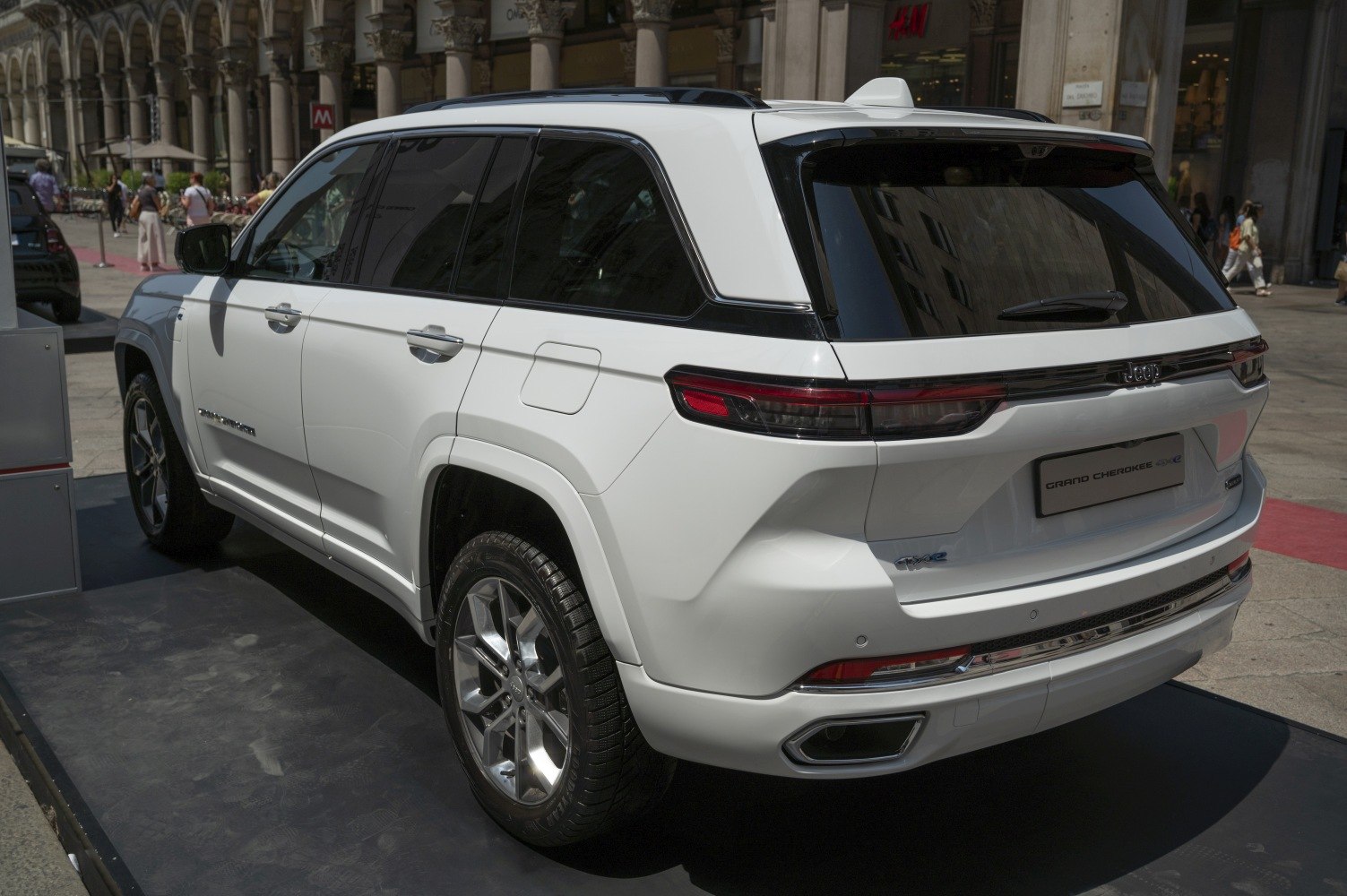 Rear view of white SUV with modern taillights and alloy wheels