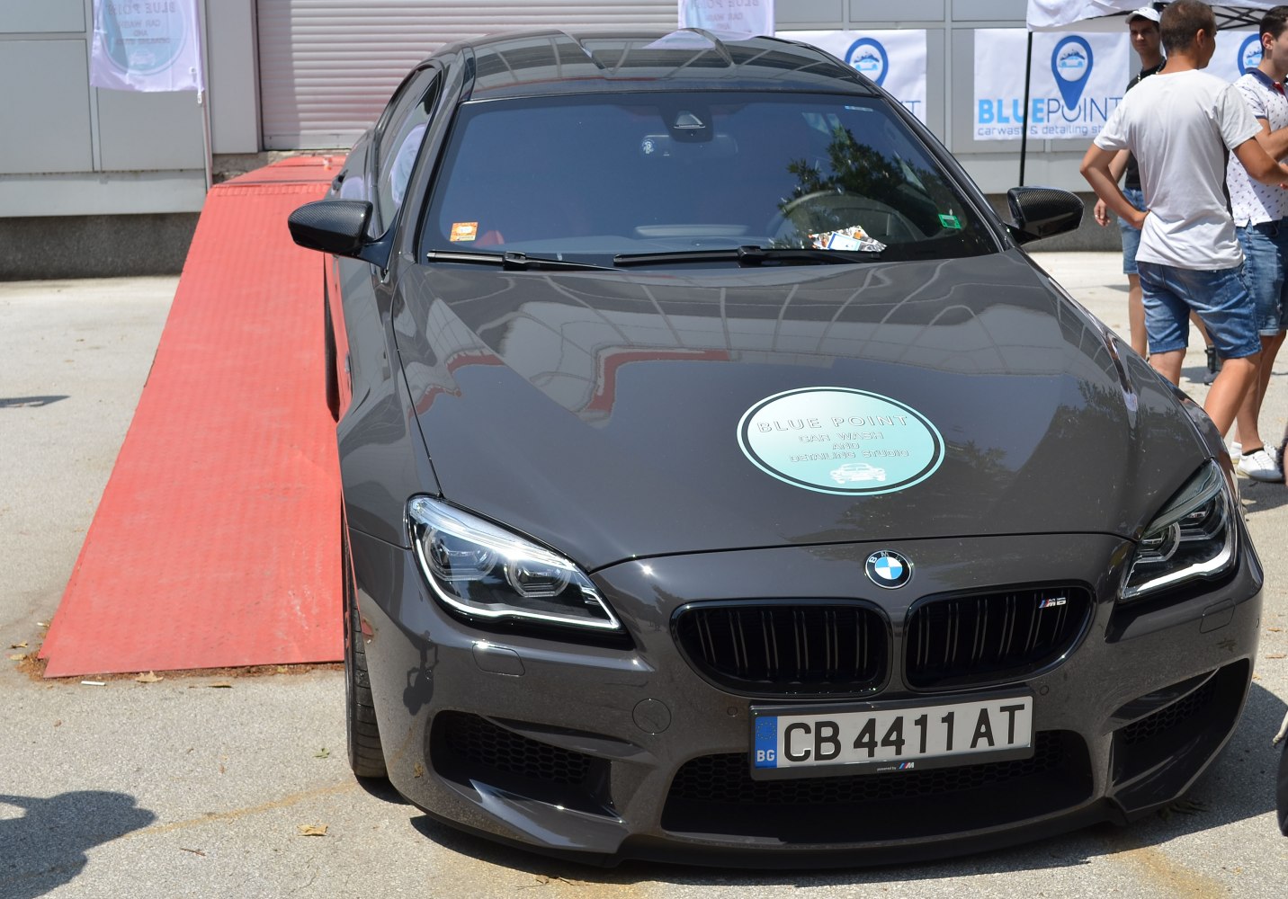 Aggressive front fascia with sporty headlights and kidney grille.