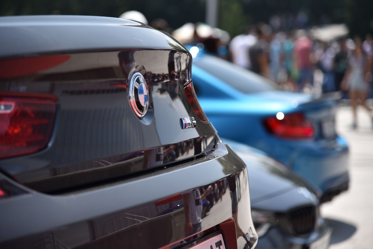 Close-up of rear badge and tail light on luxury coupe