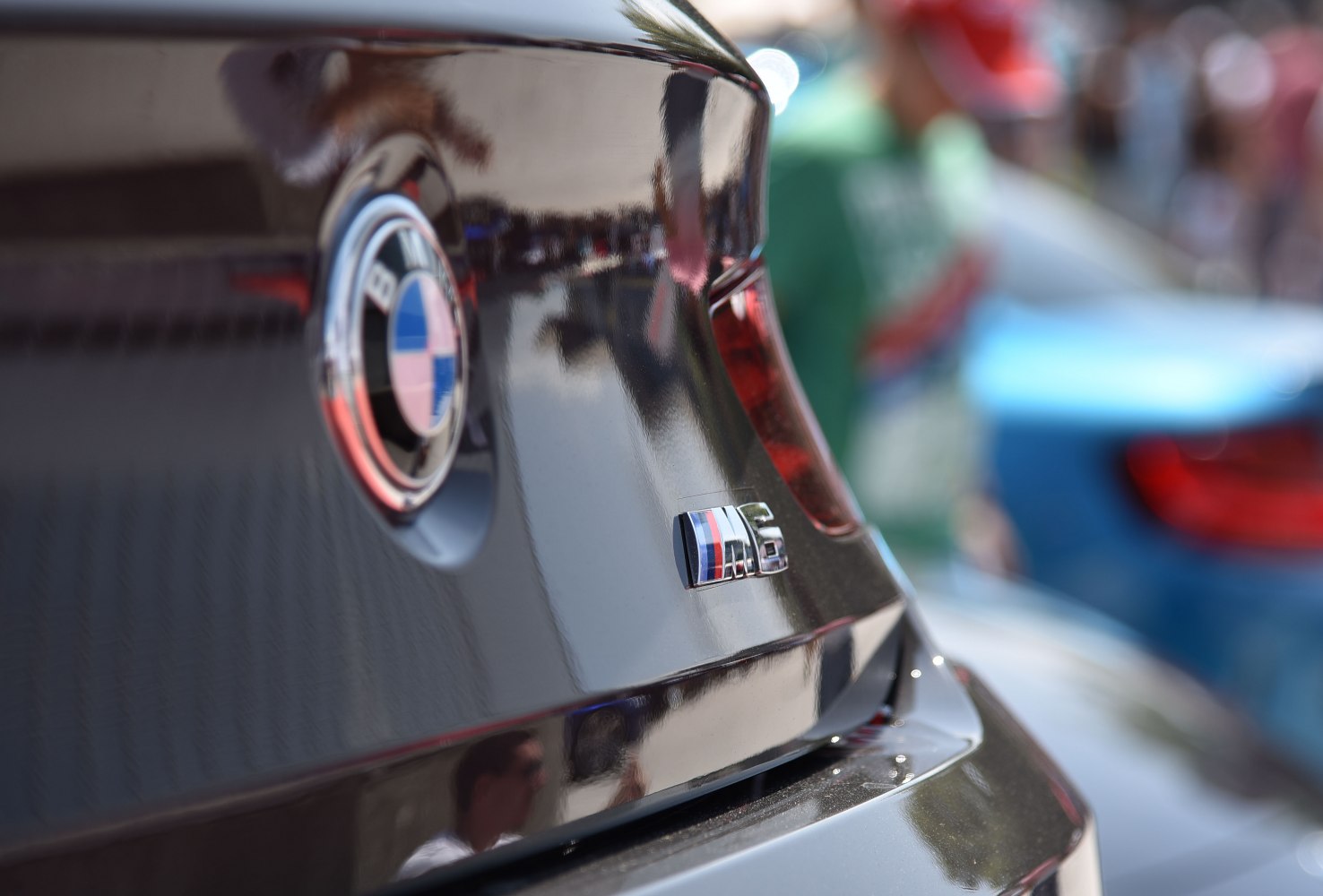 Close-up of BMW emblem and M6 badge on black car rear