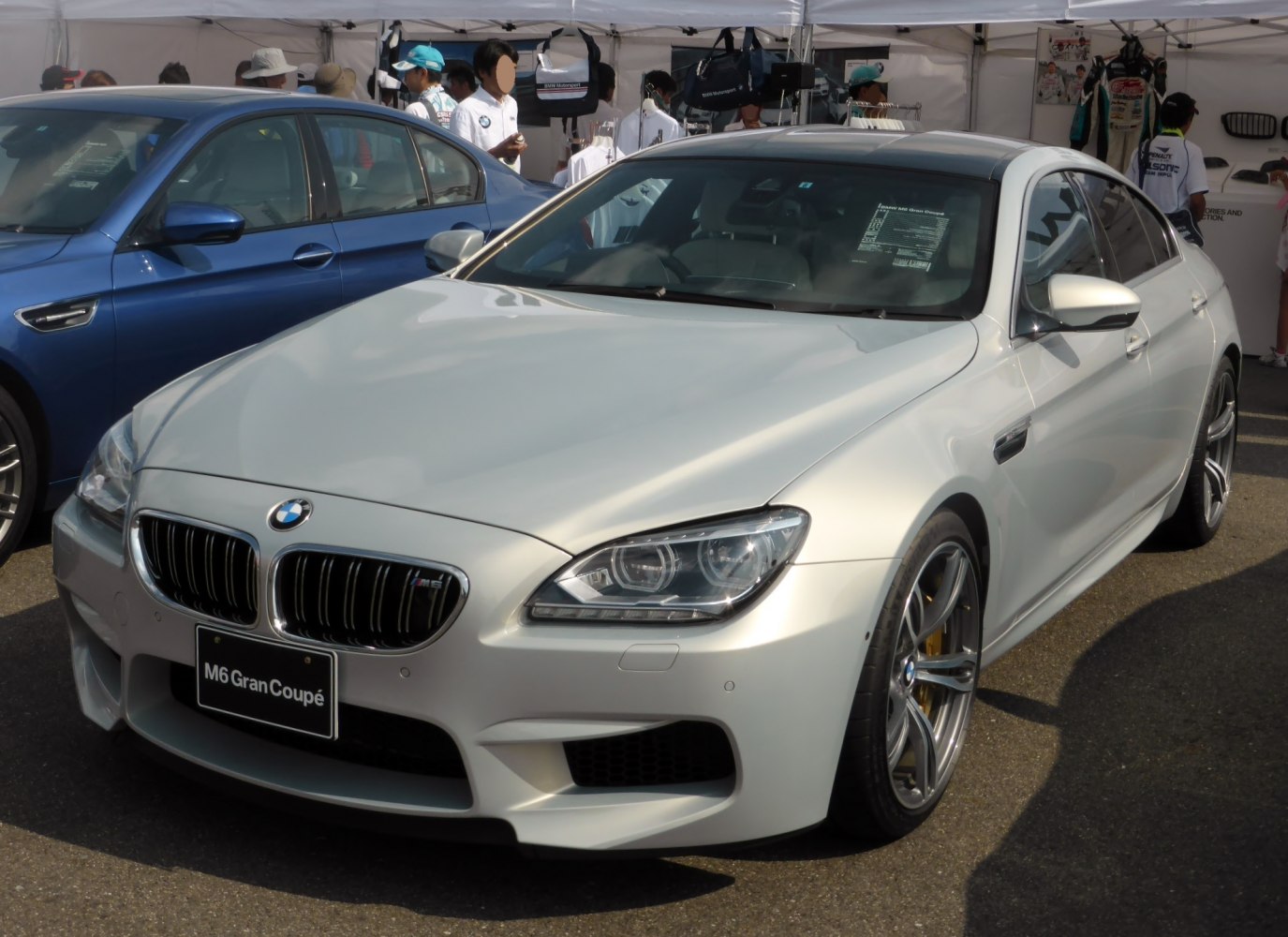Luxury coupe with sharp LED headlights and aggressive front grille