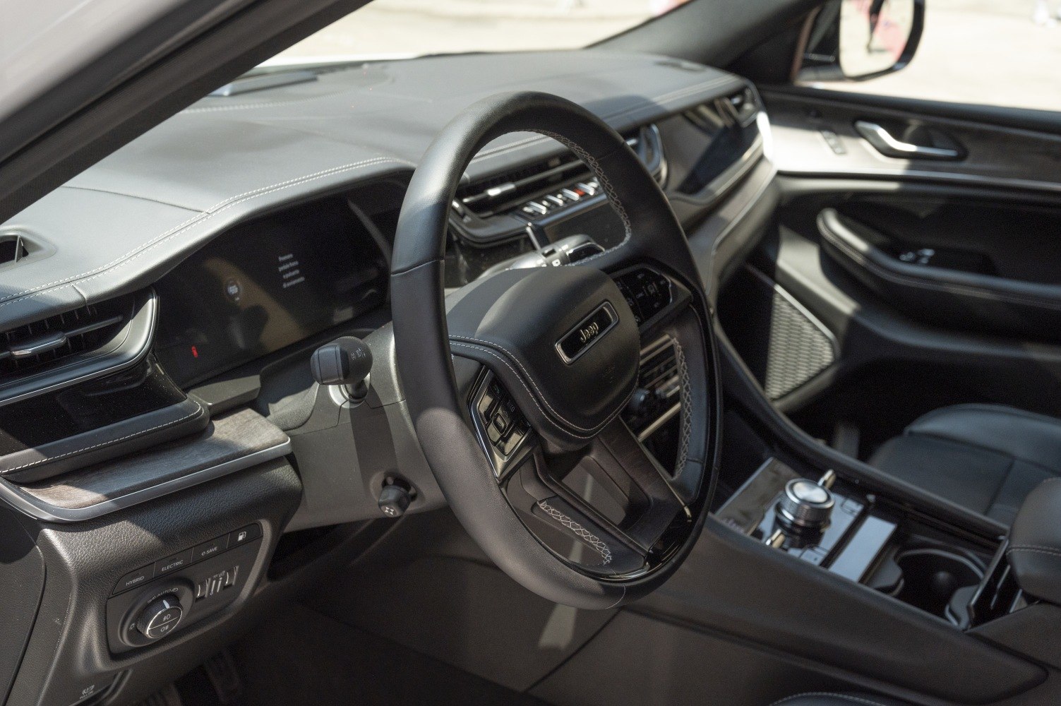 Black leather steering wheel and modern dashboard interior design