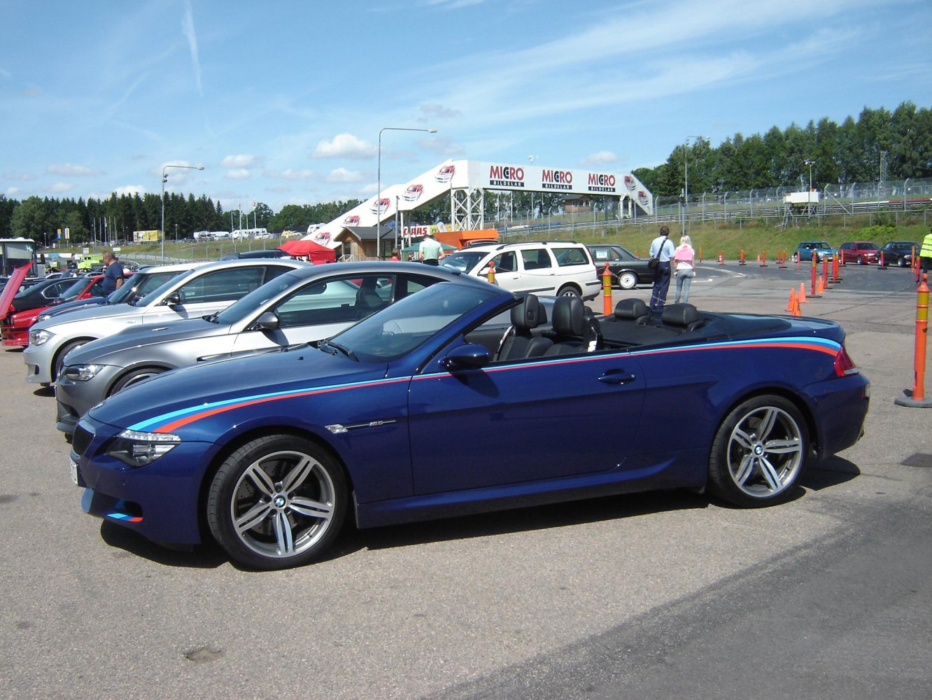 Blue convertible with sport stripe and alloy wheels