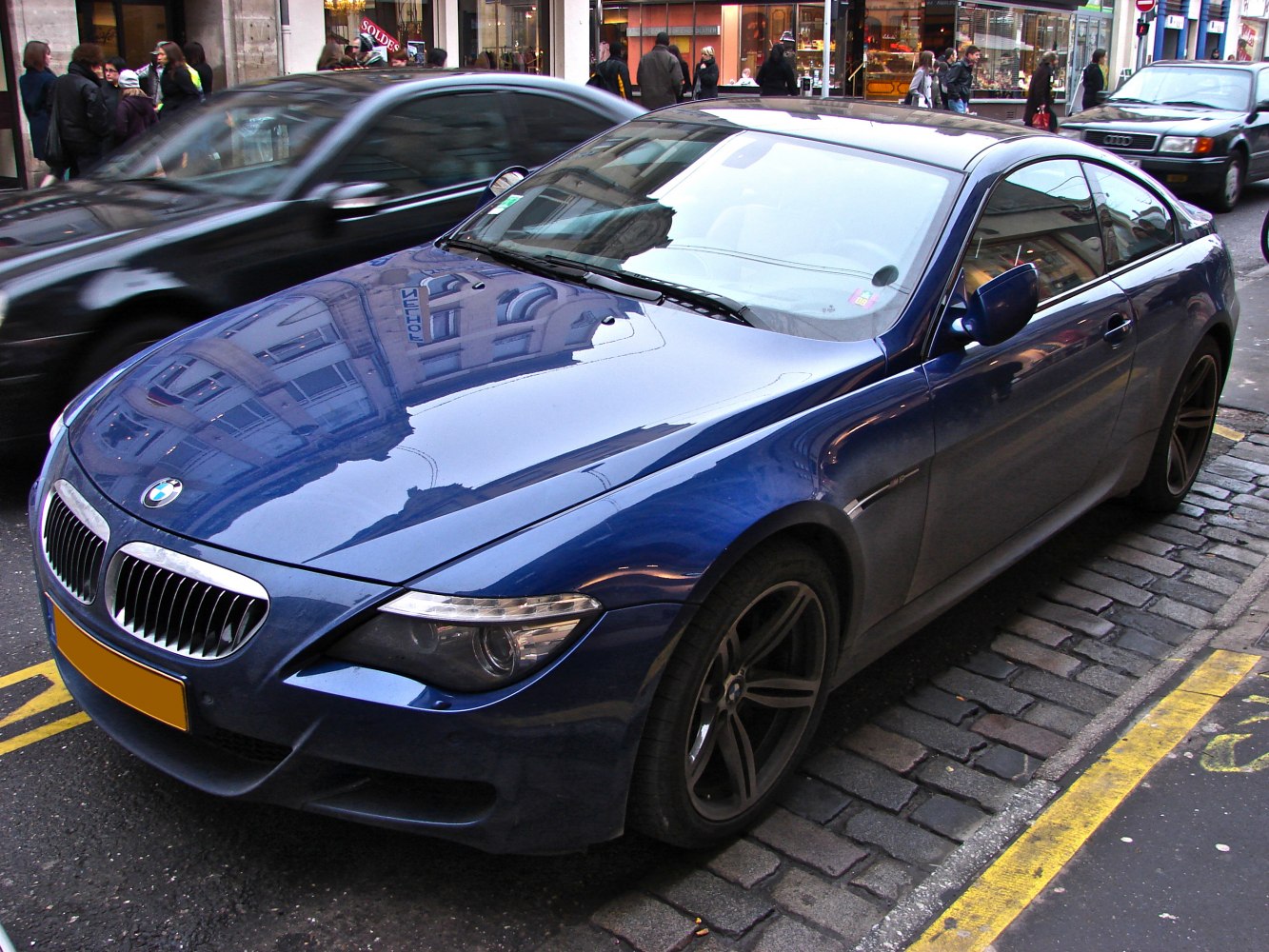 Sleek front view with distinctive headlights and sporty alloy wheels