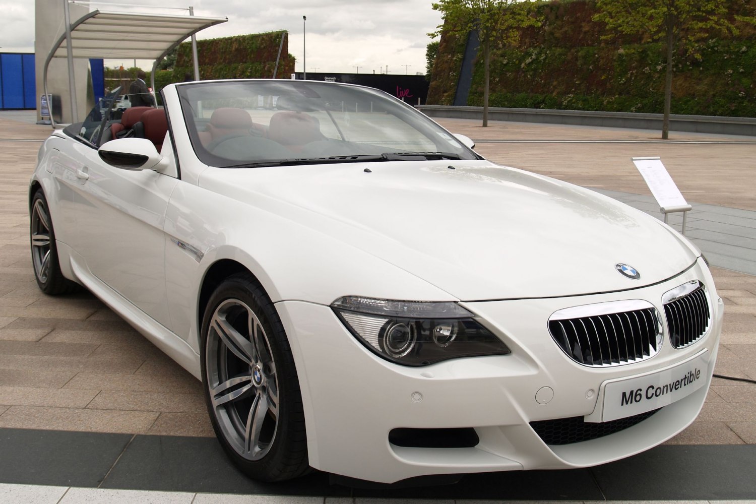 Front view of white convertible with kidney grille and sporty wheels