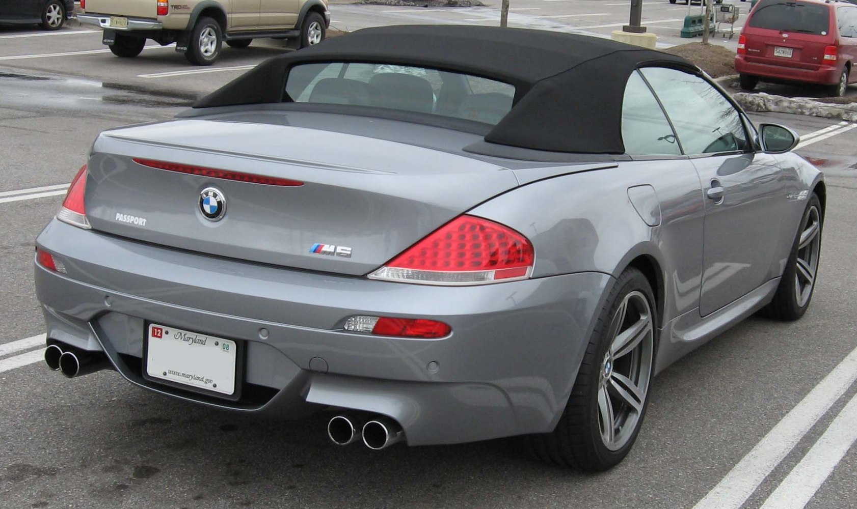 Rear view of convertible with quad exhaust and black soft top