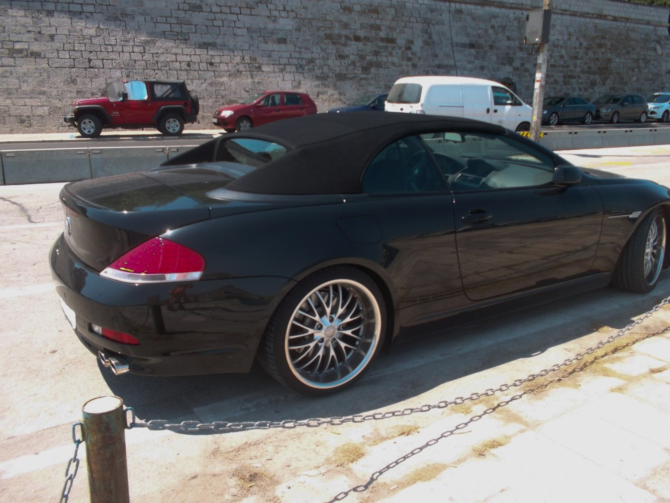 Black soft top convertible rear with alloy wheels