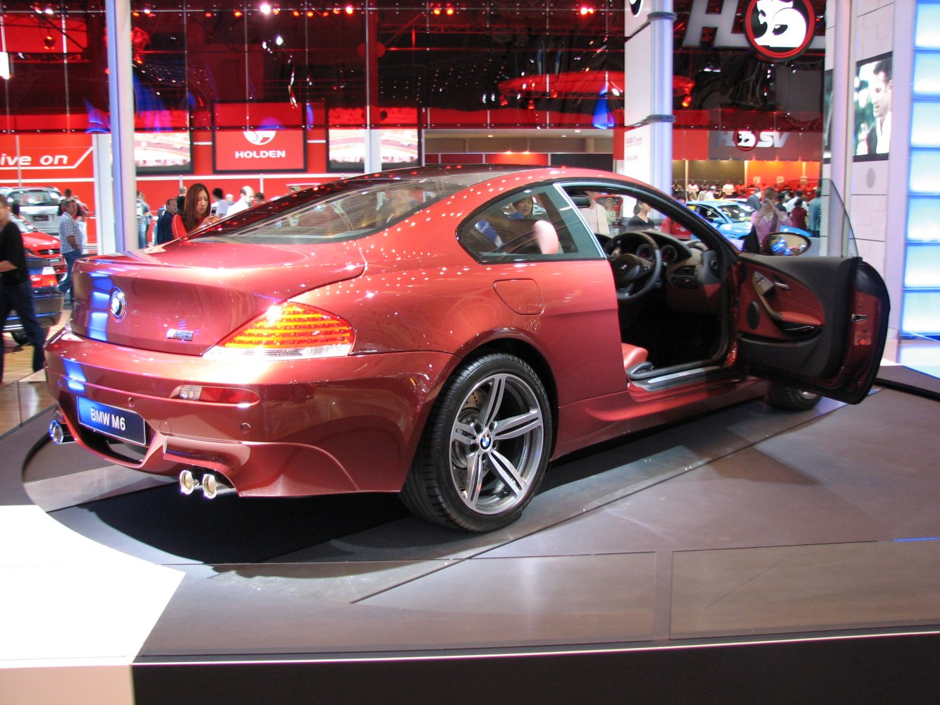 Rear side view with open door and dual exhaust