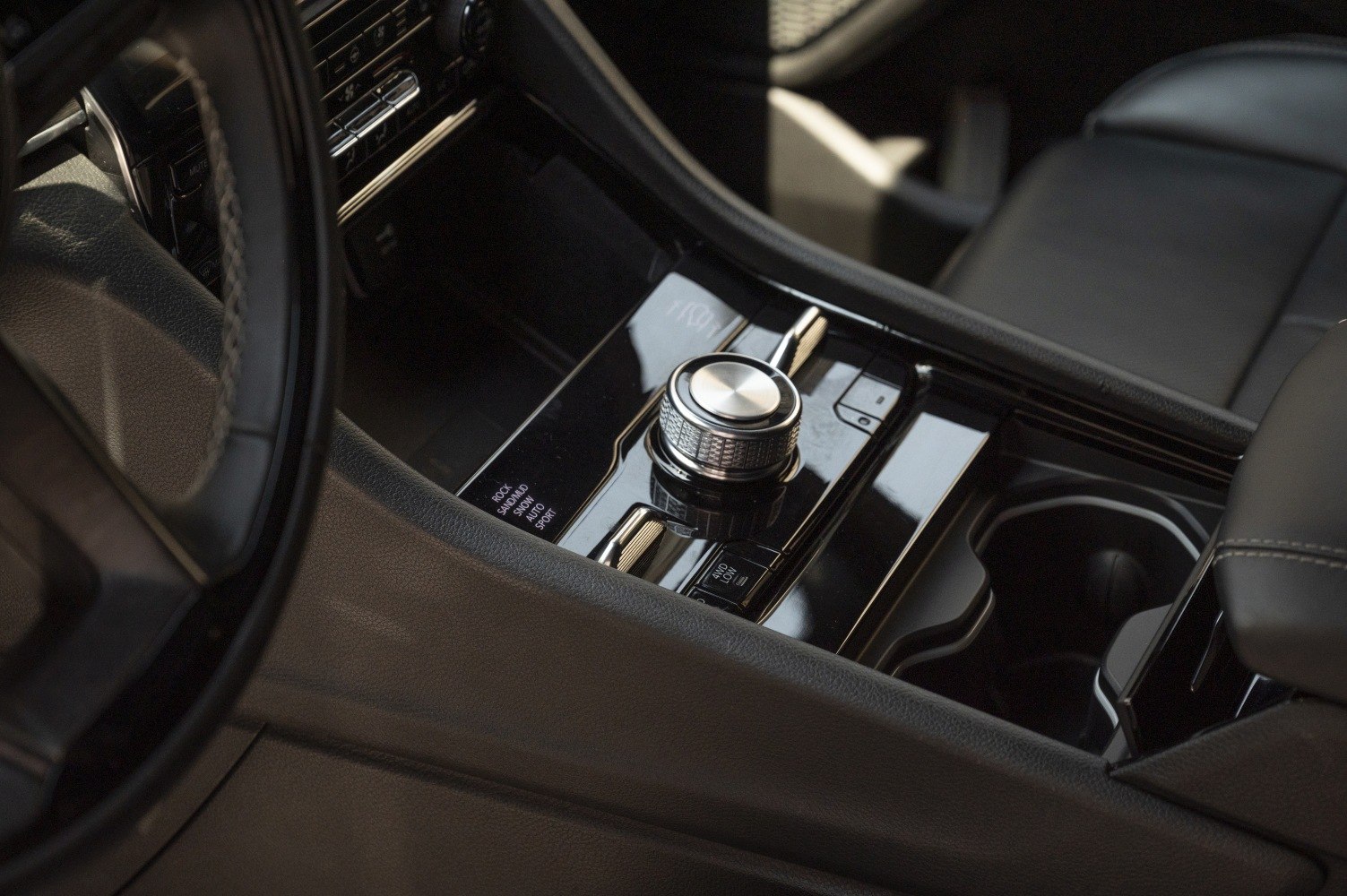 Center console with terrain mode selector dial and modern control buttons
