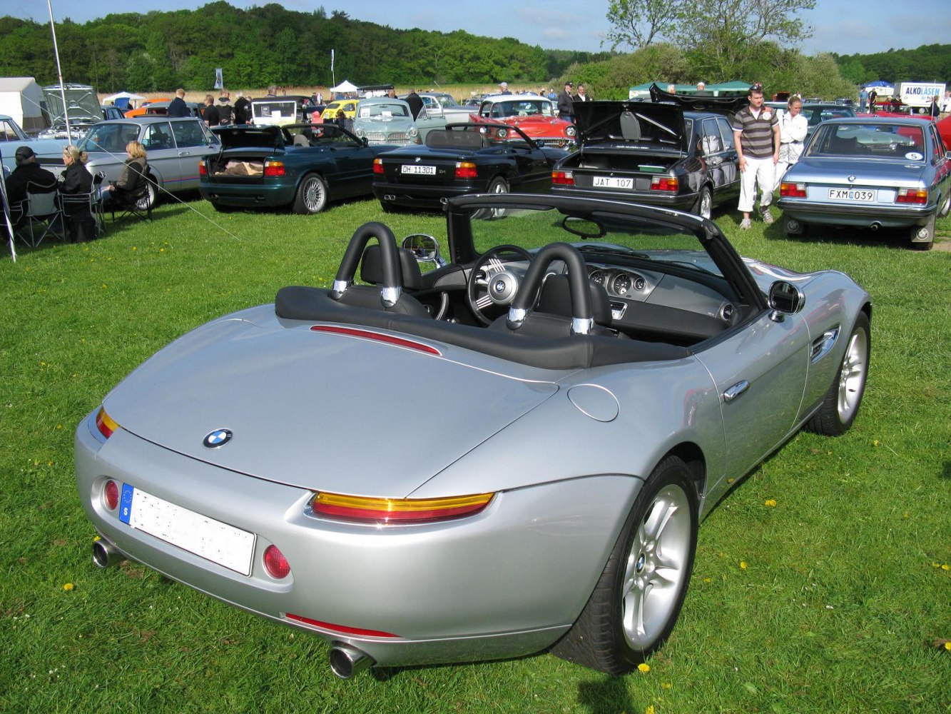 Sleek convertible rear view with dual exhaust and leather interior