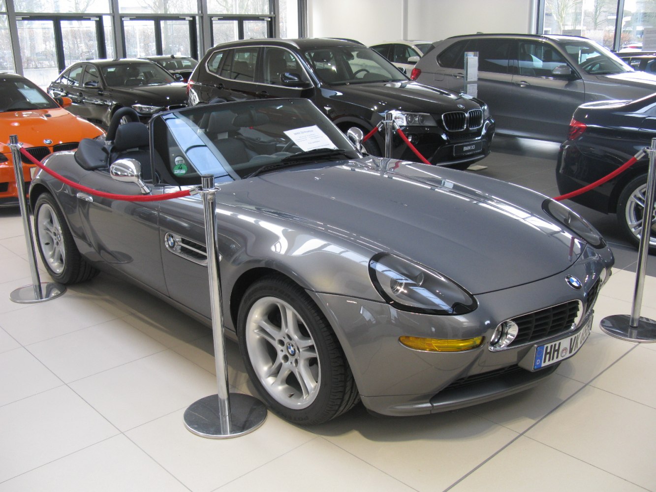 Gray convertible roadster with rounded headlights and smooth aerodynamic design