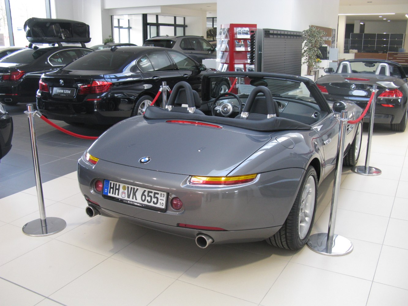 Rear view of convertible sports car with dual exhaust and distinctive taillights