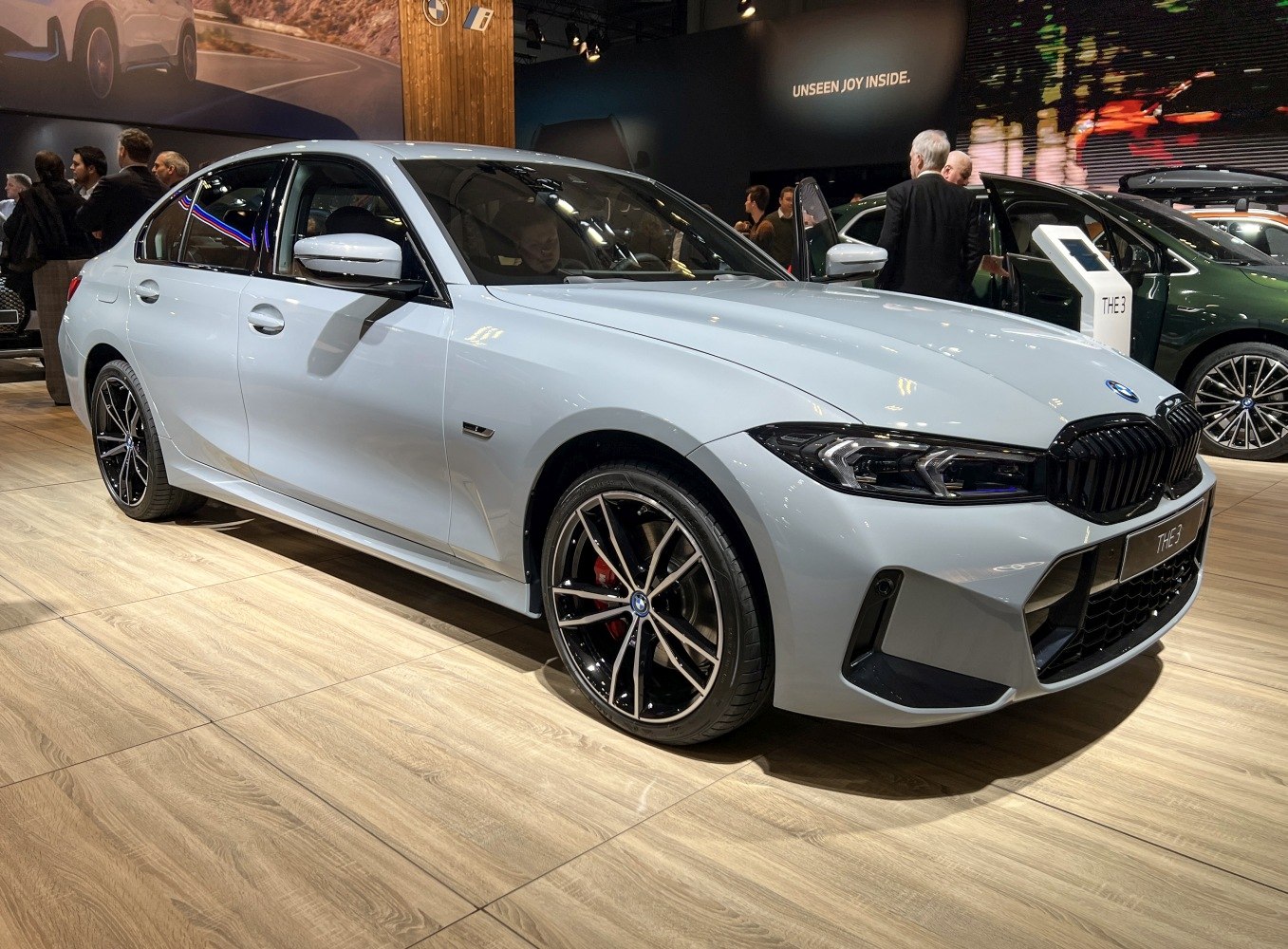 White BMW 3 Series sedan with sleek body and modern alloy wheels
