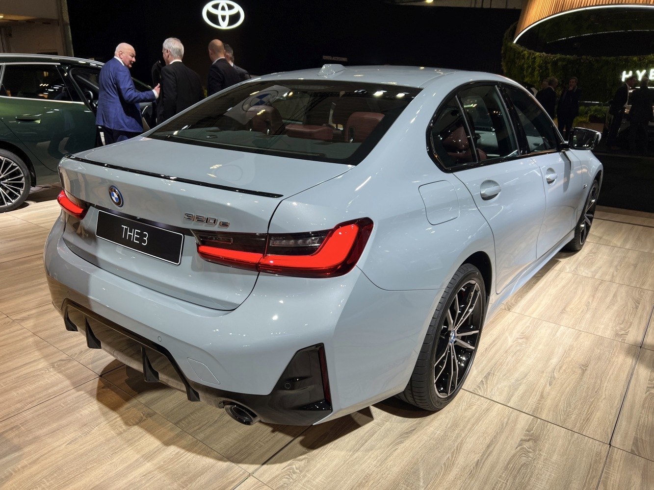 Rear view of a sedan with LED tail lights and sporty rear diffuser