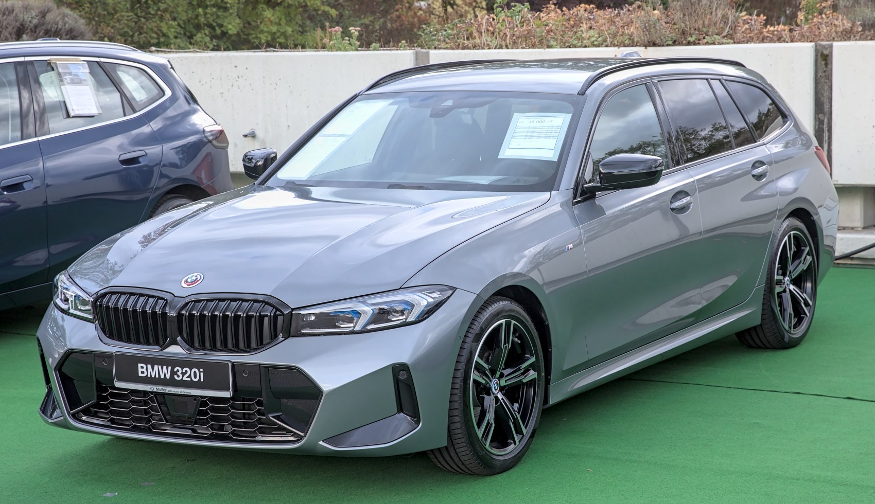 Front view and side profile with sporty wheels of a modern estate car.