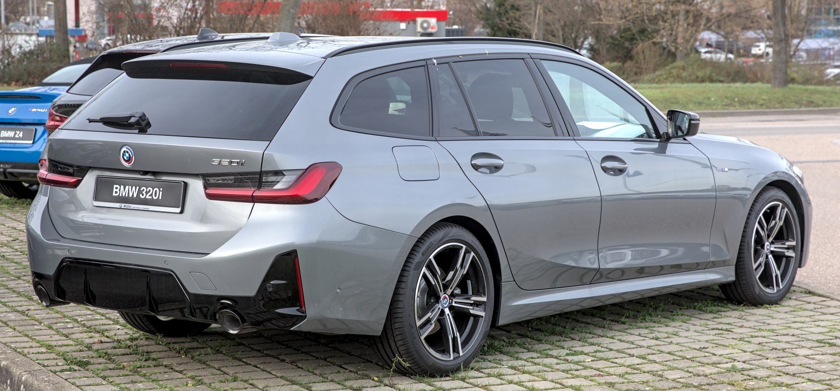 Rear and side view of a modern wagon with sporty alloy wheels and distinctive taillights