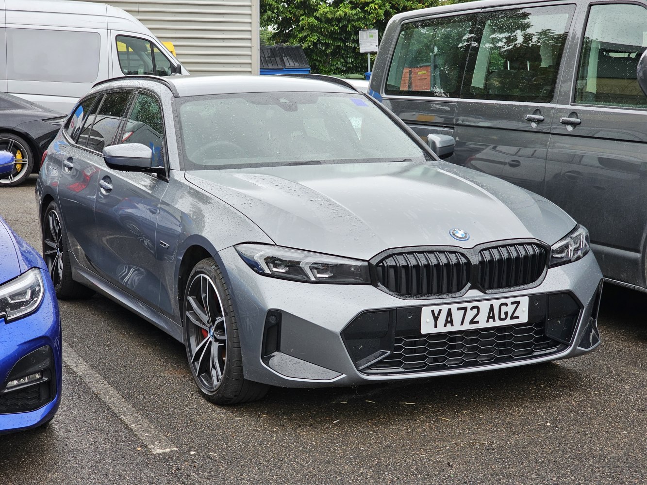 Front view of touring vehicle with black kidney grille and sporty wheels