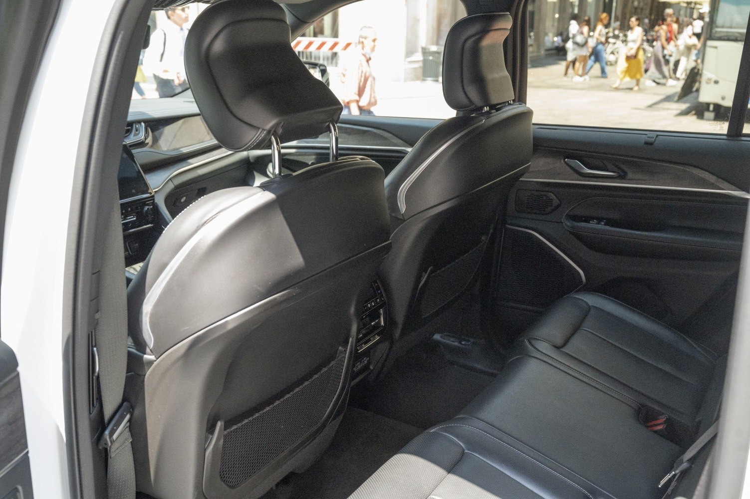 Leather rear seats and rear climate control panel in SUV interior