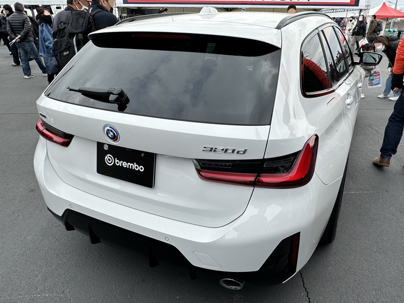 Rear view of car with modern taillights and rear wiper