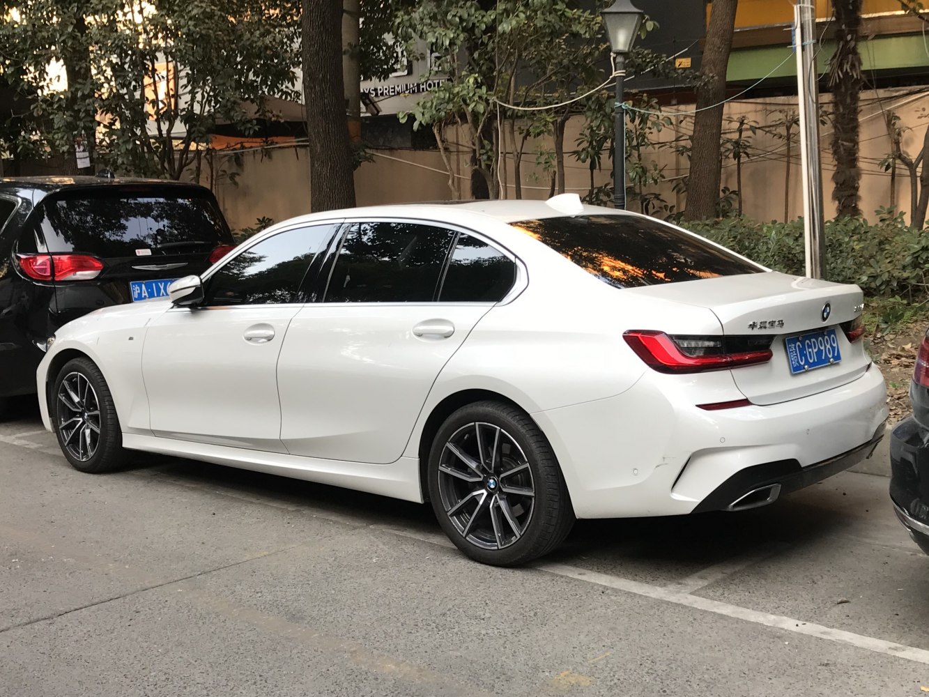 Sleek rear side view of luxury sedan with alloy wheels