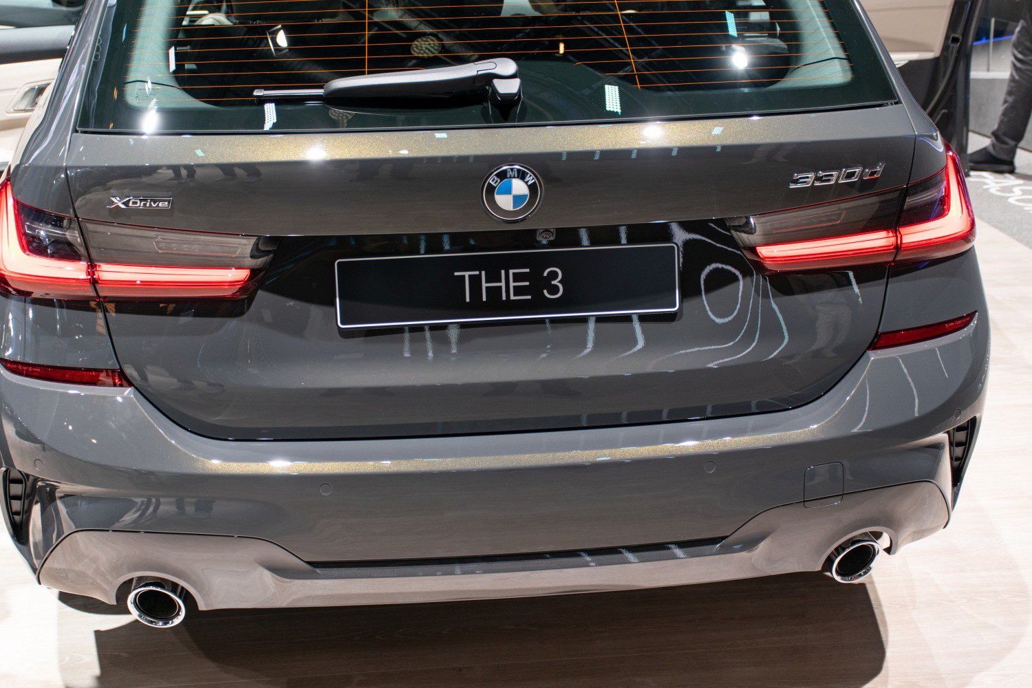 Rear view showing LED tail lights, XDrive and 330d badges, dual exhaust