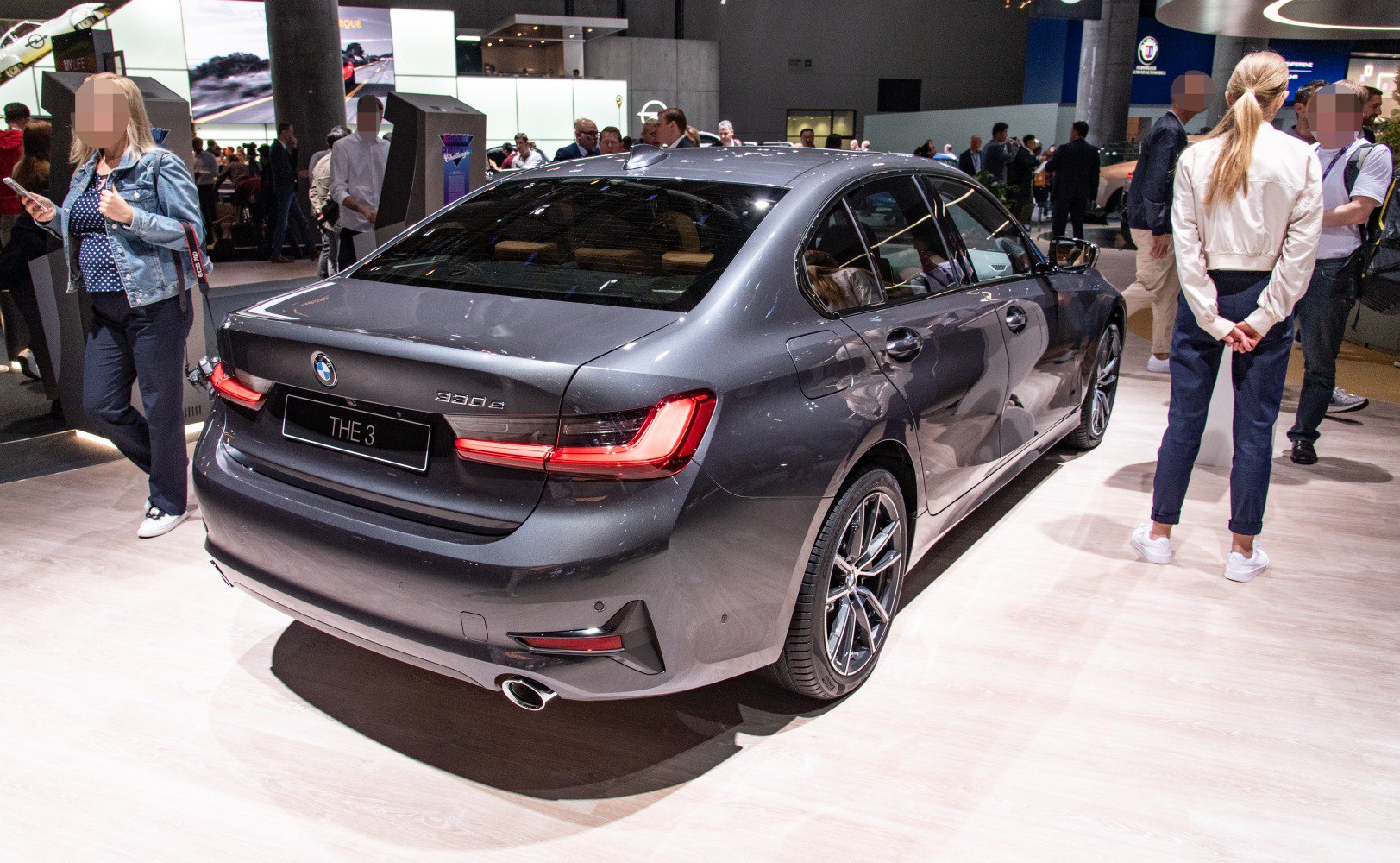 Rear view with LED tail lights and dual exhaust of a modern sedan