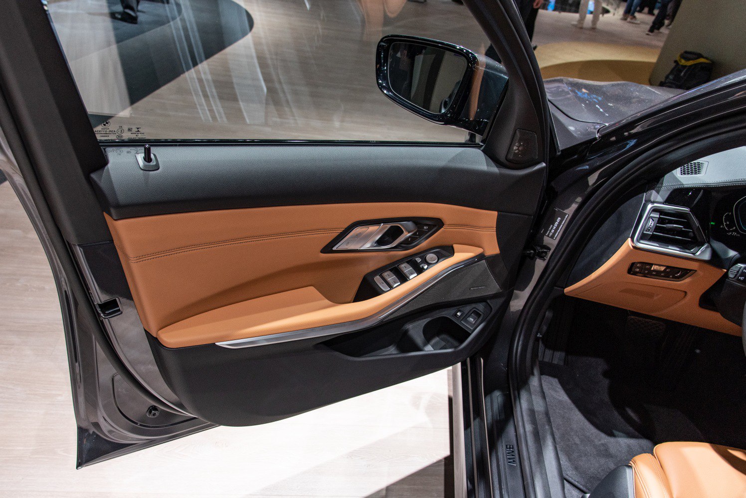 Interior door panel with window controls and leather trim