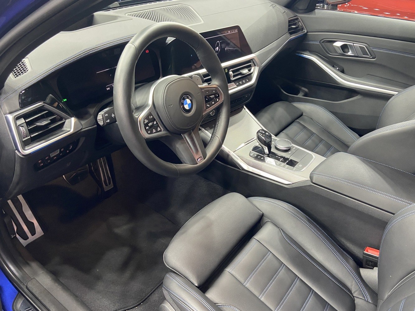 Modern luxury interior with digital displays and leather seats