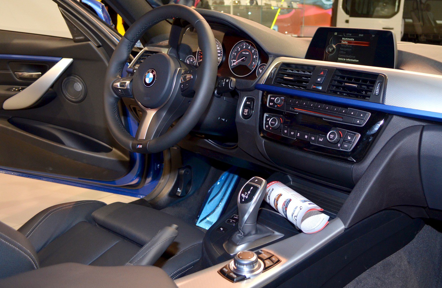 BMW 3 Series interior dashboard and gear shifter with multimedia screen