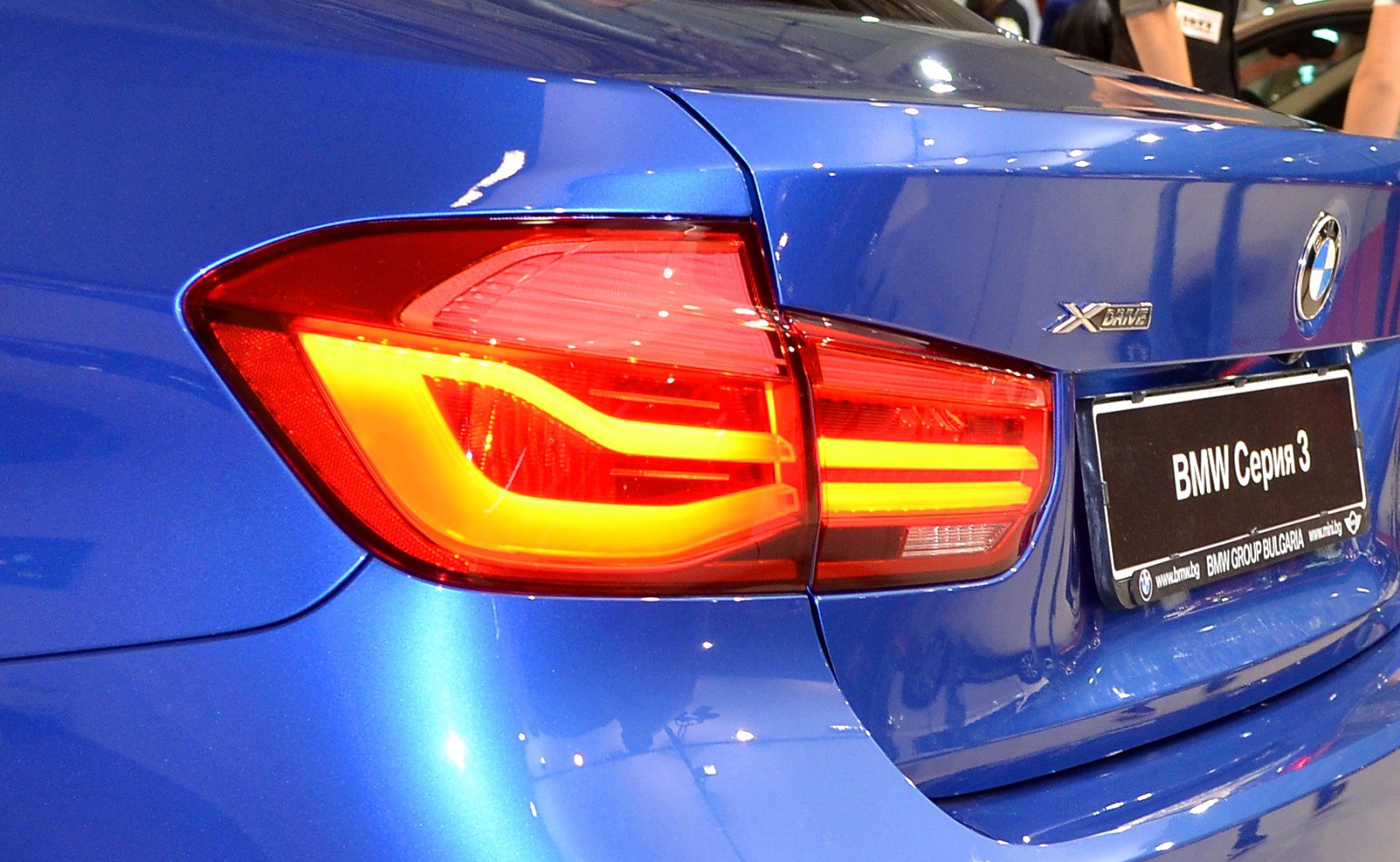 Rear LED tail light design on a blue sedan