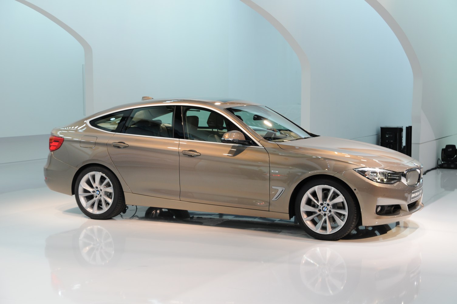 Side profile with alloy wheels and sleek sedan design
