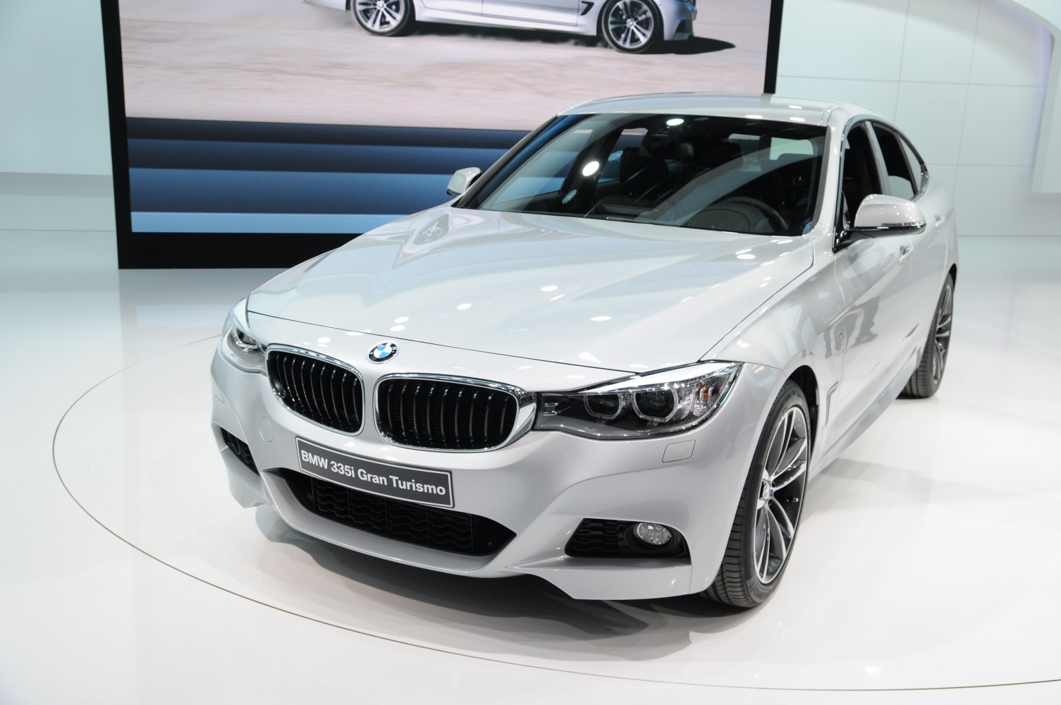 Front view of a sporty sedan with distinctive BMW kidney grille and sleek headlights