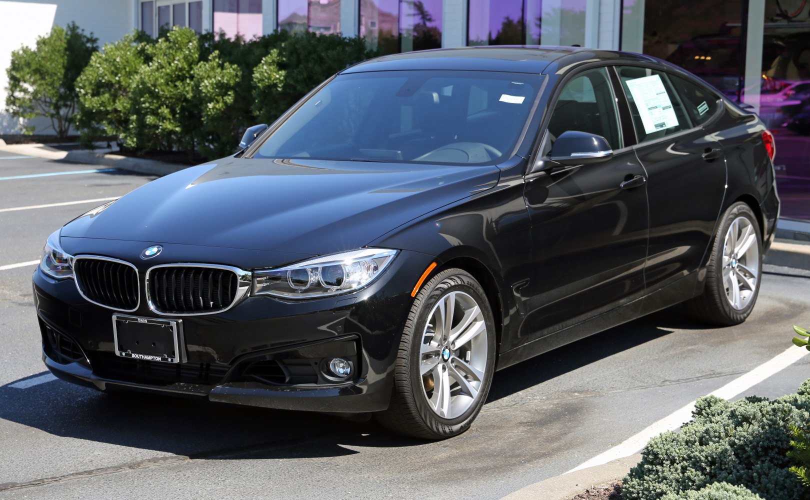 Front and side view of 2013 BMW Gran Turismo F34 with alloy wheels
