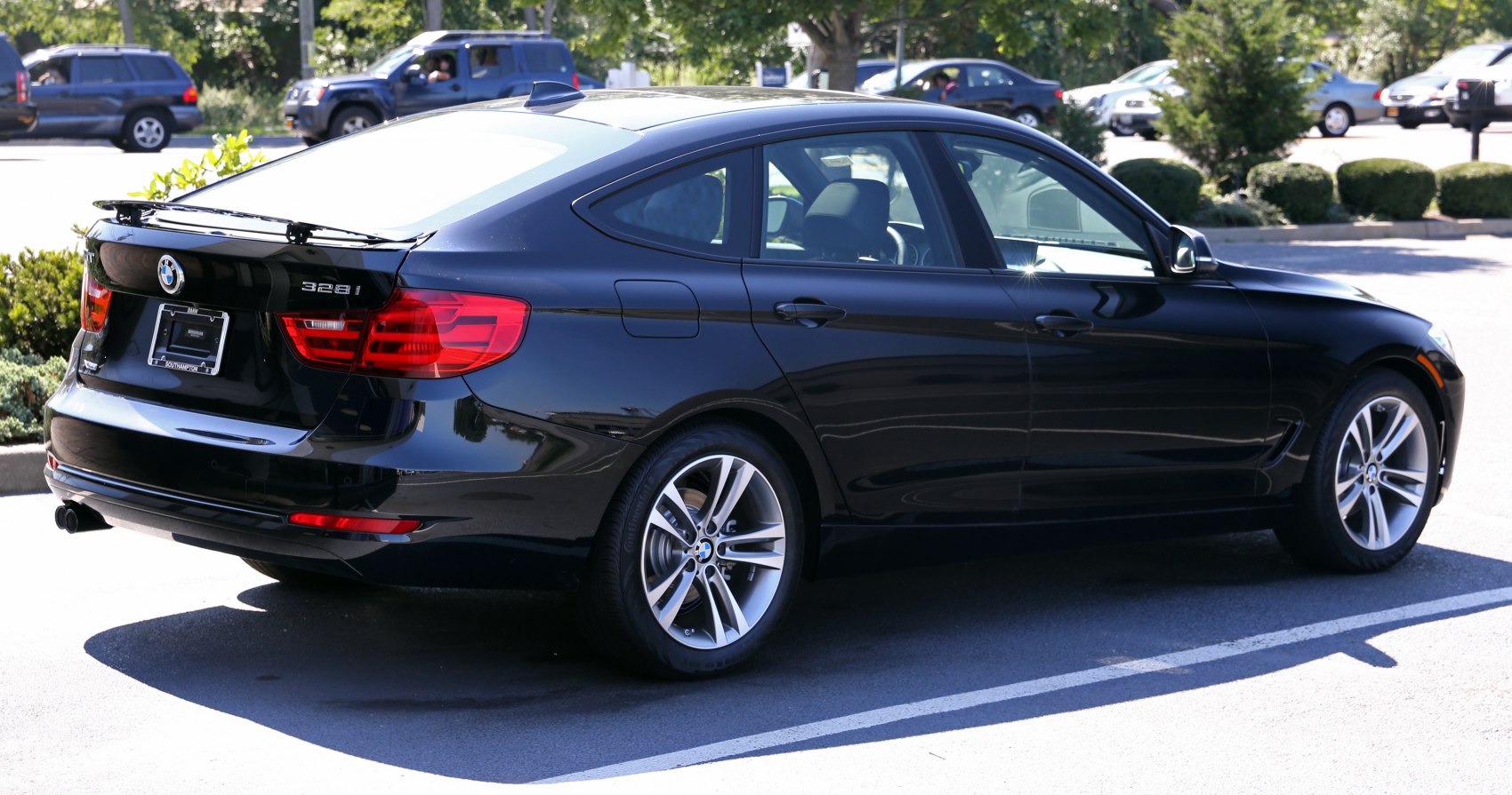 Rear side view of black 3 Series Gran Turismo with alloy wheels