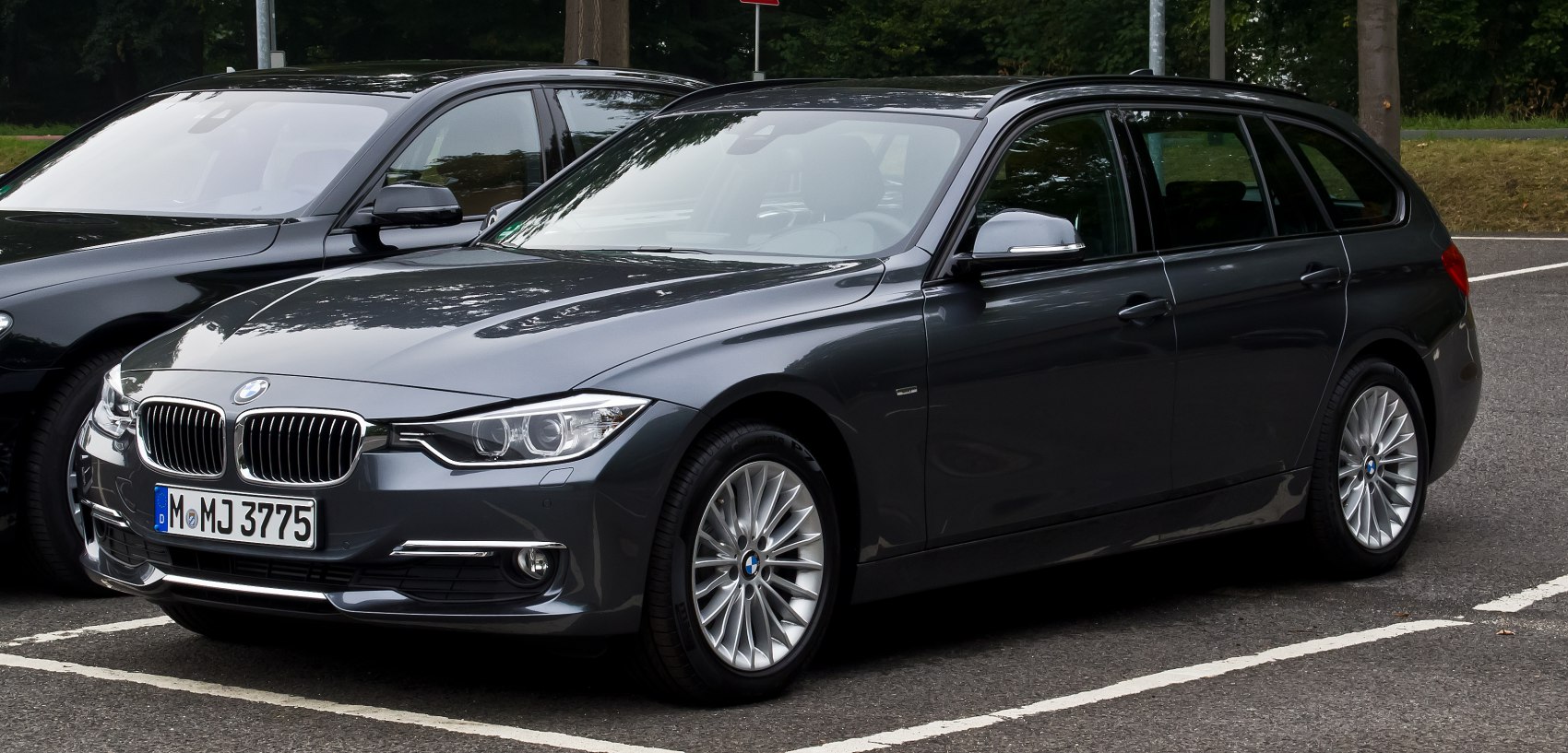 Front fascia and side profile showcasing headlights and alloy wheels