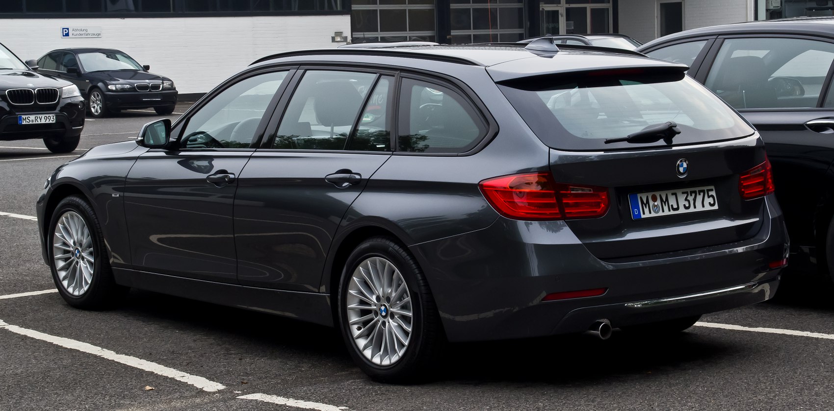 Rear and side profile of a luxury station wagon with modern tail lights and alloy wheels