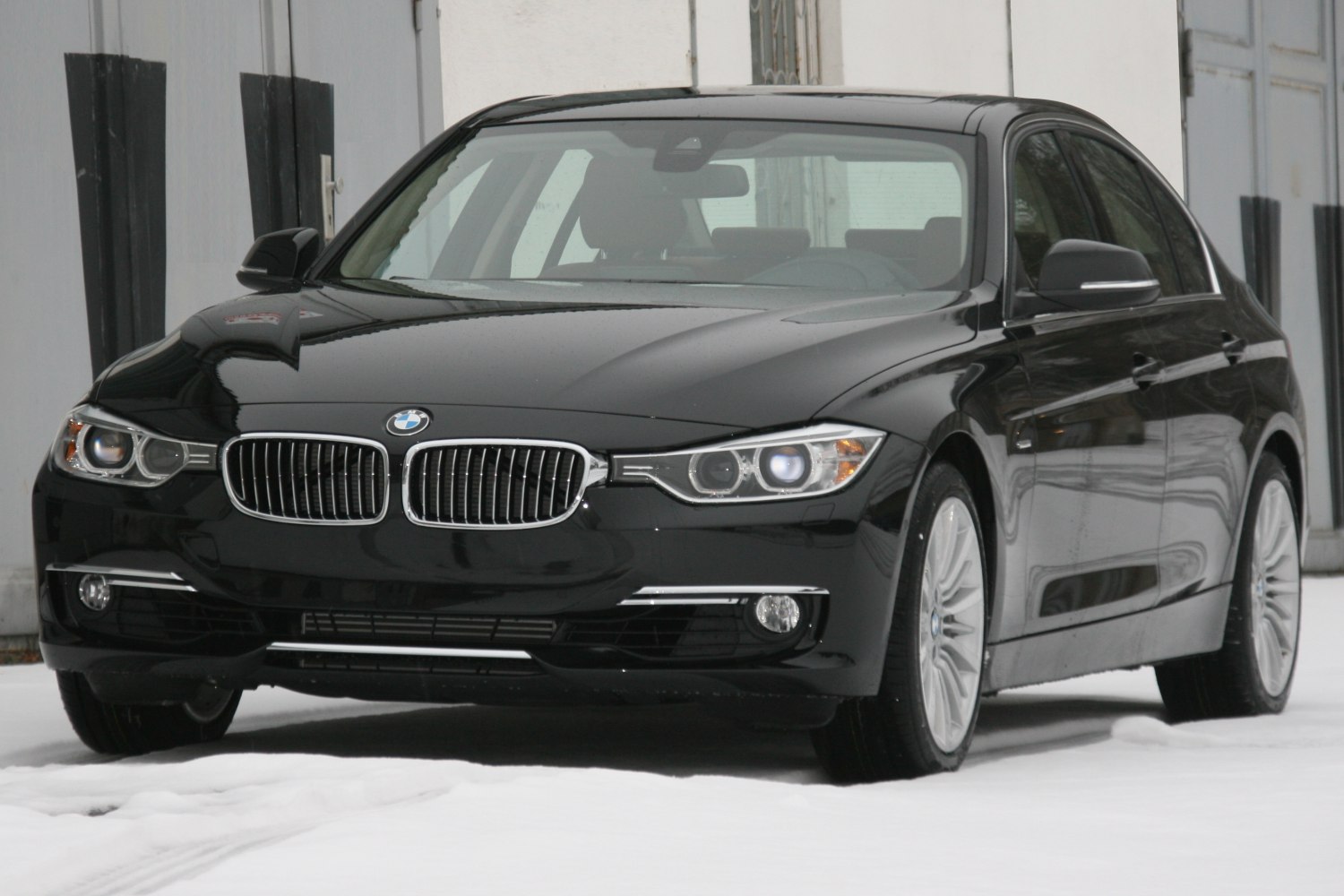 Black sedan front with kidney grille and LED headlights