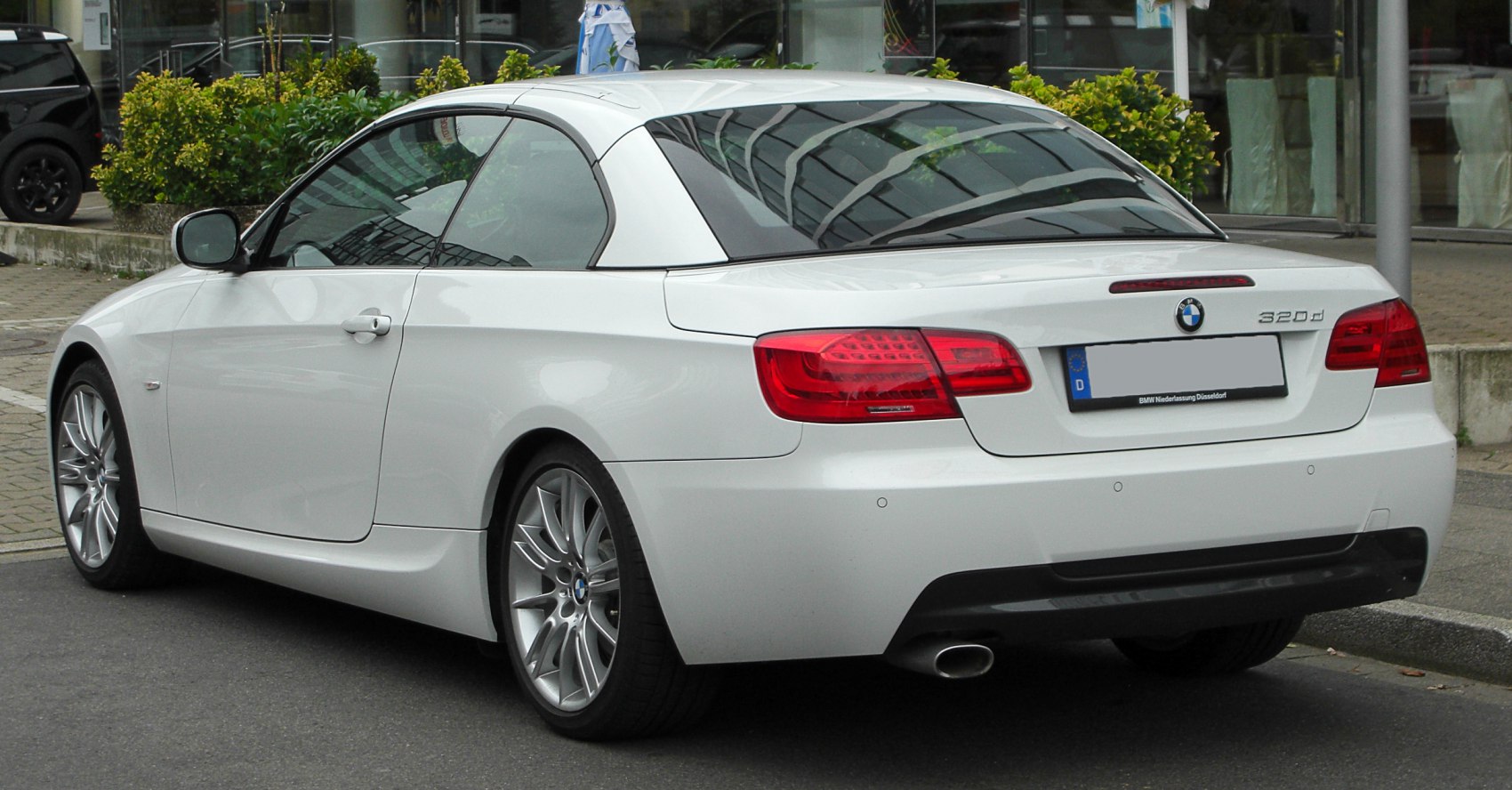 Rear view of a convertible with hardtop roof and LED taillights