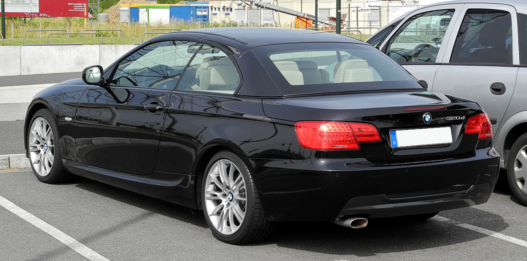 Black hardtop convertible rear with LED tail lights and alloy wheels