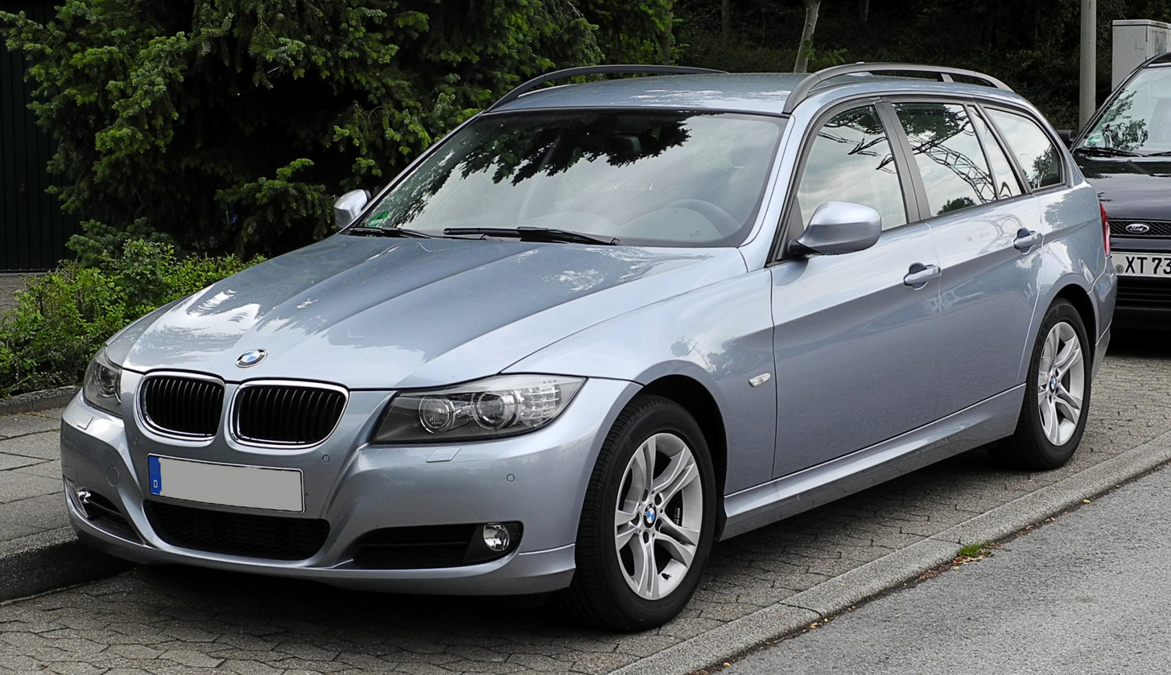 Silver station wagon with BMW kidney grille and alloy wheels
