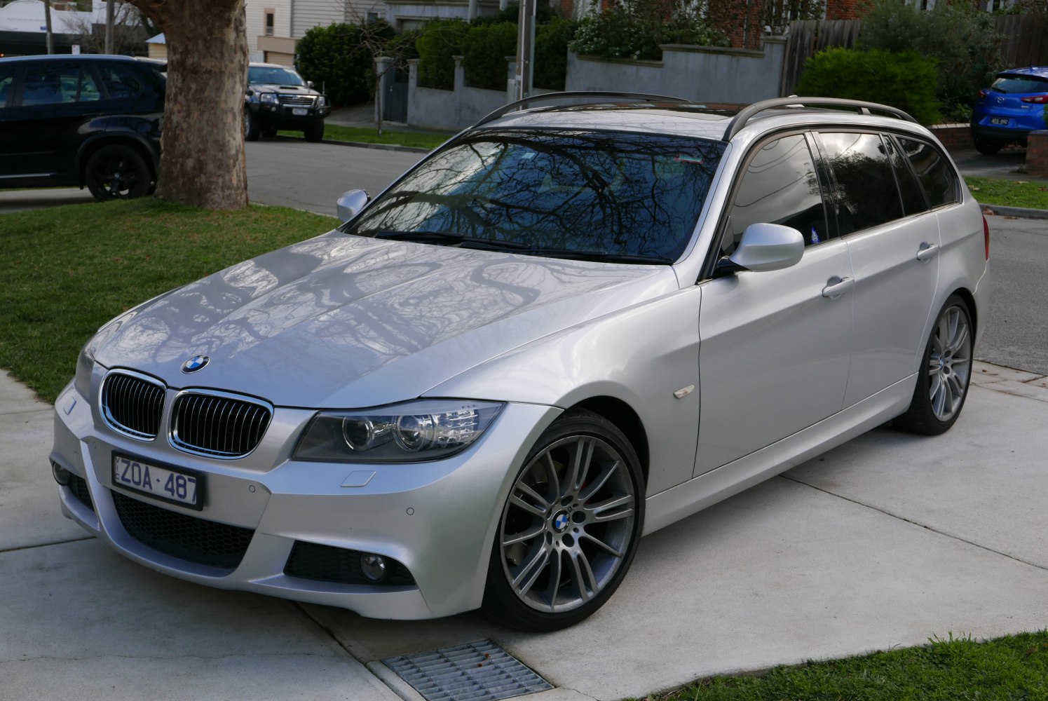 Silver station wagon with sporty alloy wheels and tinted windows