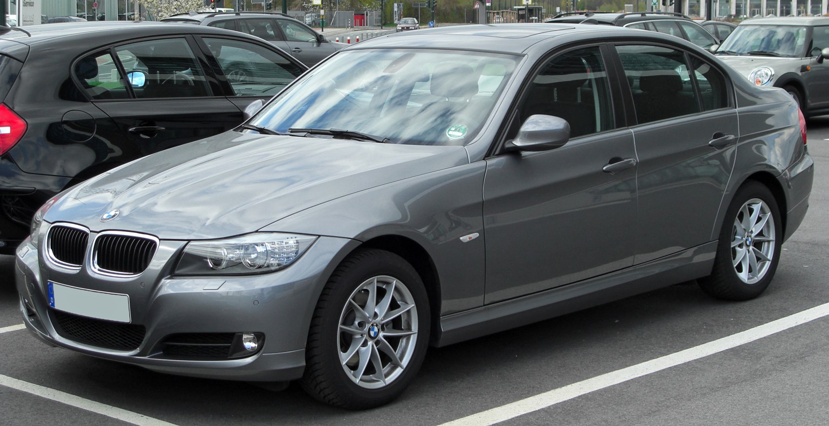 Gray sedan front and side view with alloy wheels